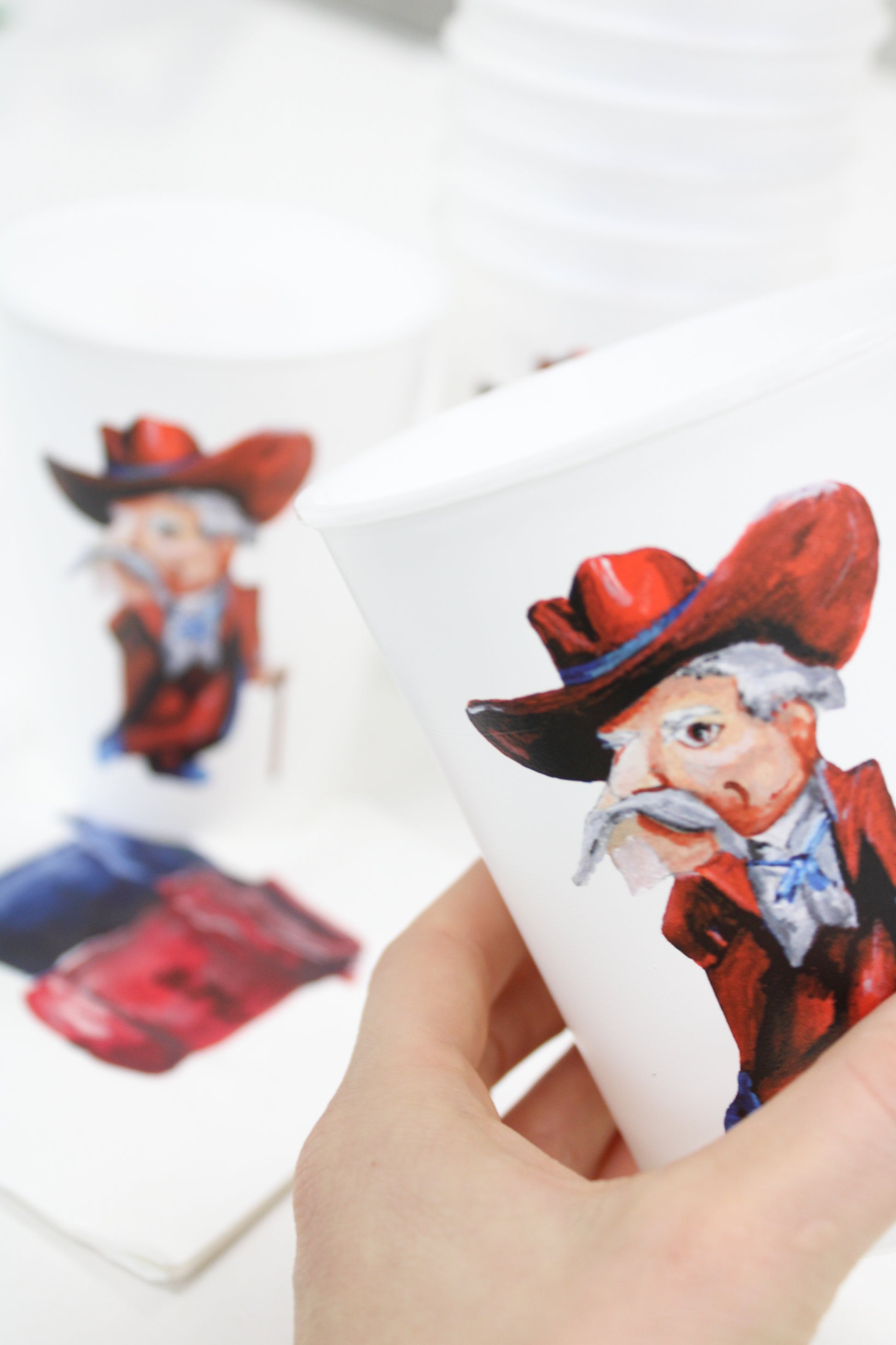 Ole Miss colonel Reb reusable, plastic cup set paired with the Trash Can Friday Paper Napkin Set