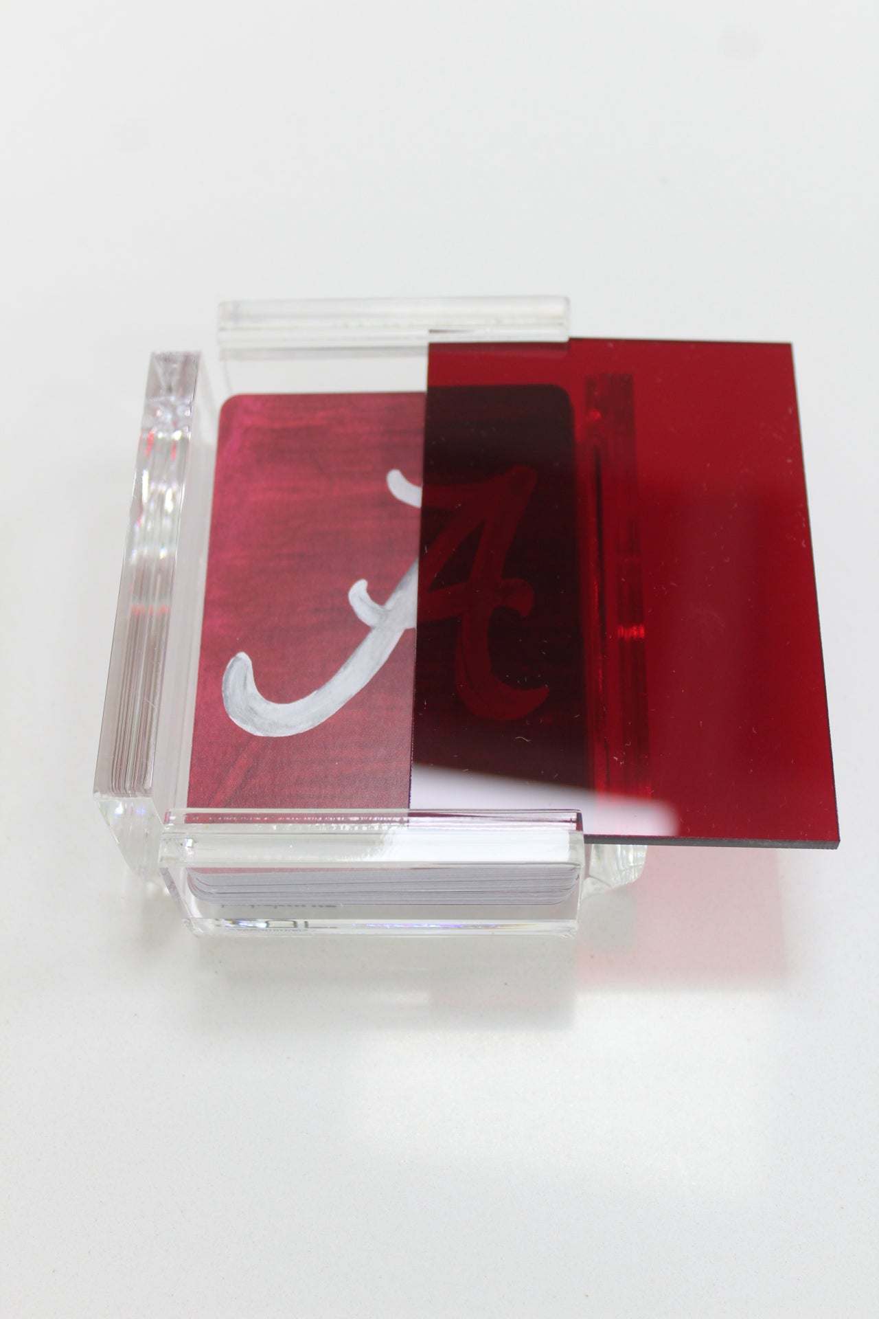 red acrylic playing card case from FOSTER